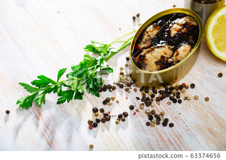 Chipirones in ink with parsley, lemon and spices 63374656