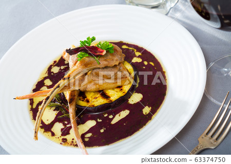 Lamb ribs served with slice of eggplant Lamb ribs served with slice of eggplant 63374750