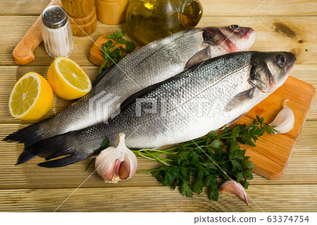 Two raw sea bass fish Two raw sea bass fish 63374754