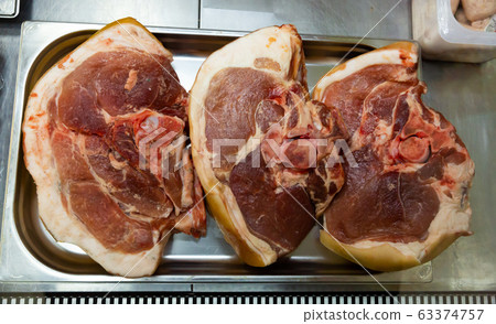 Raw pork in display of butcher market Raw pork in display of butcher market 63374757