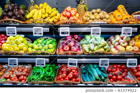 Vegetables and fruits on supermarket shelves 63374922