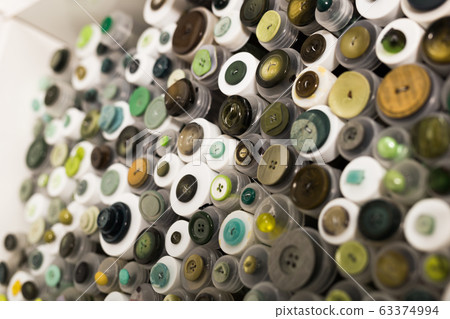 Buttons in plastic containers in store Buttons in plastic containers in store 63374994