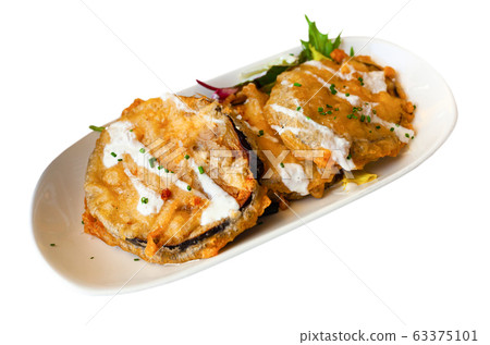 Battered eggplant slices with yogurt sauce Battered eggplant slices with yogurt sauce 63375101