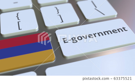 E-government or Electronic Government text and flag of Armenia on the keyboard. Modern public services related conceptual 3D rendering E-government or Electronic Government text and flag of Armenia on the keyboard. Modern public services related conceptual 3D rendering 63375521