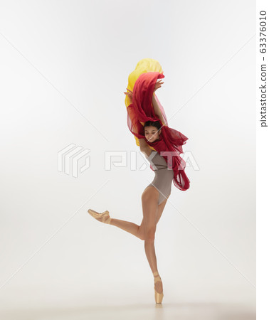 Young graceful tender ballerina on white studio background Young graceful tender ballerina on white studio background 63376010