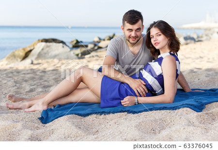 Positive loving couple resting and hugging Positive loving couple resting and hugging 63376045