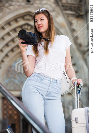 Girl photographing in city Girl photographing in city 63376691