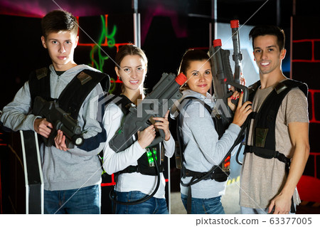 Friends playing lasertag game Friends playing lasertag game 63377005