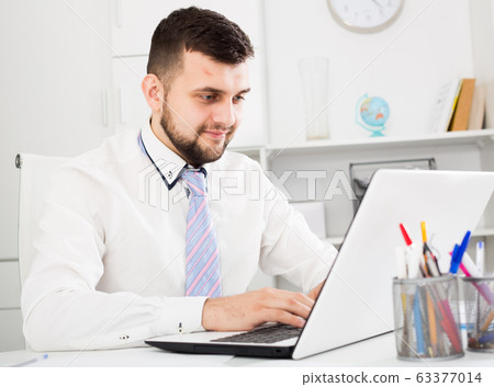 Man working productively 63377014