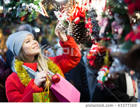 Girl shopping Christmas decorations Girl shopping Christmas decorations 63377169
