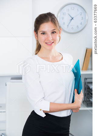 Successful business woman in office Successful business woman in office 63377669