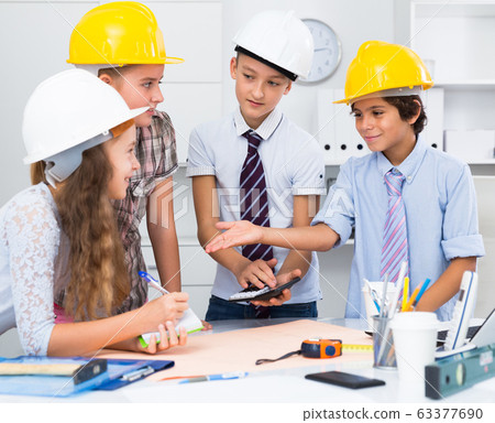 Boys and girls architects with plan Boys and girls architects with plan 63377690