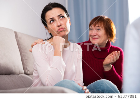 Portrait upset female looking away after conflict, mother talking 63377881