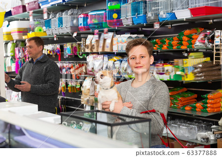 Glad man with son and dog buying pet supplies Glad man with son and dog buying pet supplies 63377888