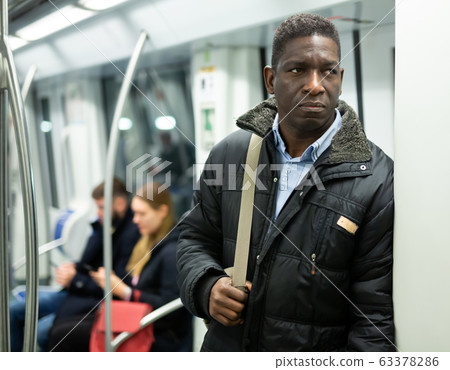 African man in metro train African man in metro train 63378286