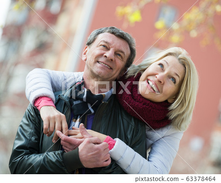 Mature loving couple in spring park Mature loving couple in spring park 63378464