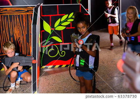 Fine african preteen girl with laser pistol Fine african preteen girl with laser pistol 63378730
