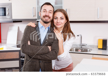 Pair of young people in furniture accessories shop Pair of young people in furniture accessories shop 63379668