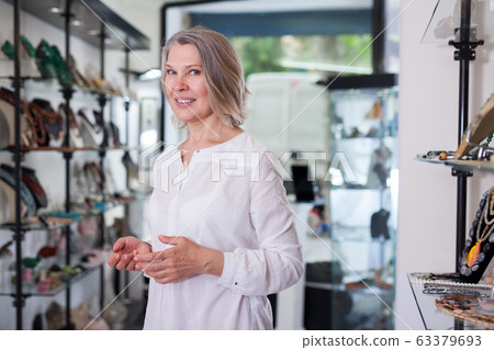 Portrait of a jewelry store woman seller 63379693