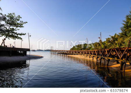 Blue sea, island, and bridge in the evening Blue sea, island, and bridge in the evening 63379874