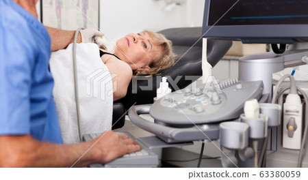 Mature woman getting ultrasound scanning examination at clinicMature woman getting ultrasound scanning examination at clinic Mature woman getting ultrasound scanning examination at clinicMature woman getting ultrasound scanning examination at clinic 63380059