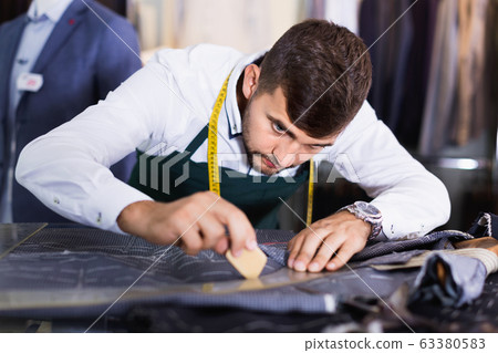 Handsome guy snipper in modern workshop 63380583