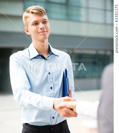 Businessman is signing successful contract Businessman is signing successful contract 63381175