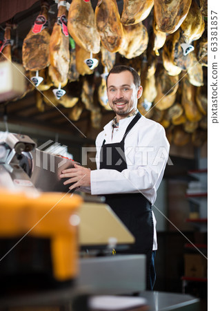 Seller offering sorts of meat Seller offering sorts of meat 63381857
