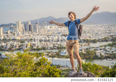 Man tourist on the background of Nha Trang city. Travel to Vietnam Concept 63382125