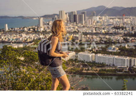 Woman tourist on the background of Nha Trang city. Travel to Vietnam Concept 63382241