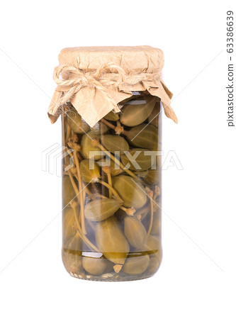 Pickled caper berries in jar isolated on white Pickled caper berries in jar isolated on white 63386639