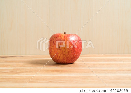 Red apple isolated on wood table. Apple Clipping 63388489