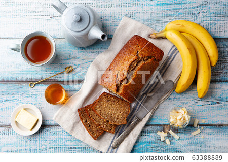 Healthy vegan oat and banana loaf bread, cake. Blue wooden background. Top view. 63388889