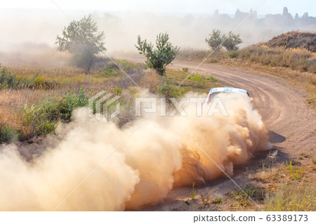 Lots of Dust Behind the Car 63389173