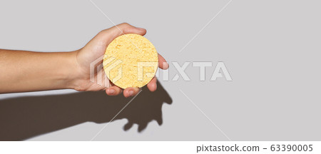 Remove makeup pad. Yellow cosmetology skin care routine 63390005