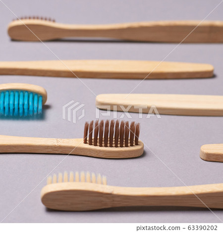 Many toothbrash at table. Different color. Diagonal 63390202