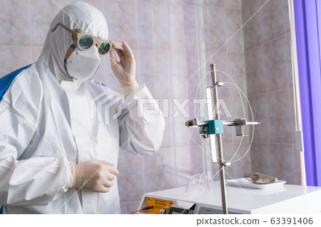 Doctor in protective suit at pandemic period 63391406
