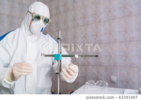 Doctor in protective suit at pandemic period 63391407