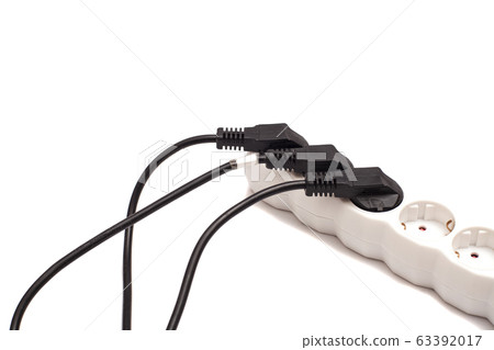 Many plugs plugged into electric power bar 63392017
