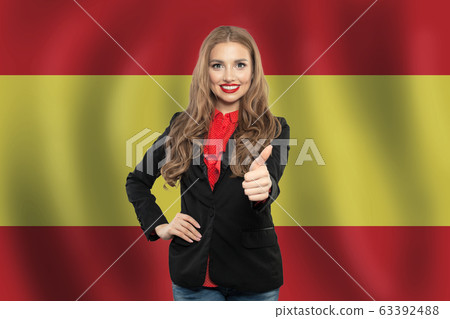 Spain. Happy student girl with thumb up Spain. Happy student girl with thumb up 63392488