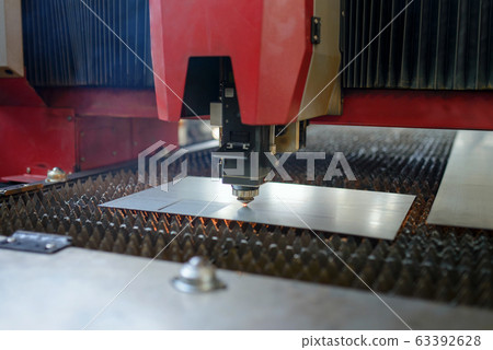 Industrial fiber laser cutter. Plasma cutting of metal. Industrial fiber laser cutter. Plasma cutting of metal. 63392628