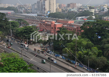 Chittagong cityscape of Bangladesh Chittagong station building with a retro look Cars and rickshaws running on the road in front of the station Chittagong cityscape of Bangladesh Chittagong station building with a retro look Cars and rickshaws running on the road in front of the station 63397866