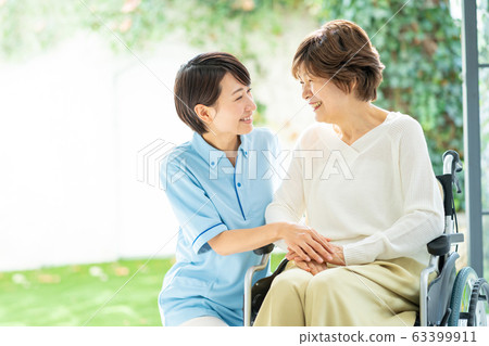 Nursing care wheelchair caregiver senior woman medical image Nursing care wheelchair caregiver senior woman medical image 63399911