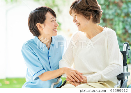 Nursing care wheelchair caregiver senior woman medical image 63399912