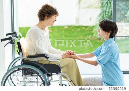 Nursing care wheelchair caregiver senior woman medical image Nursing care wheelchair caregiver senior woman medical image 63399919