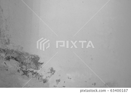 Close-up of White cement crack wall and peeled paint caused by water and sunlight. Peel wall of White house paint with black stain. Black and White of Texture background. 63400187