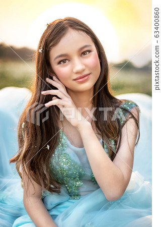 beautiful girl in nature  field 63400860