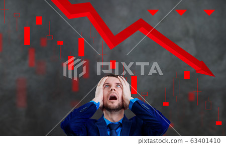 Businessman grabs the head because the stock markets collapsed. 63401410