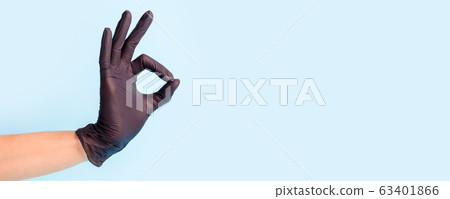 Female hand in cosmetology medicine black glove 63401866