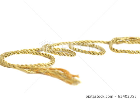 Golden rope isolated on white background Golden rope isolated on white background 63402355